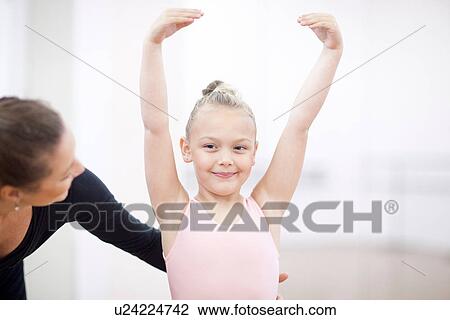 Stock Image - Portrait of a young ballerina and her teacher. Fotosearch