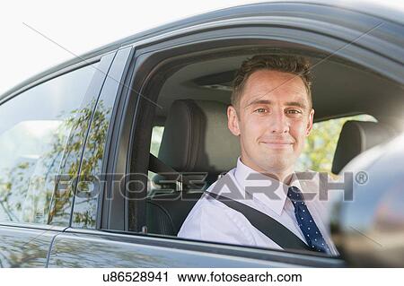 Portrait of businessman in car View Large Photo Image Stock Image - Portrait of businessman in car. Fotosearch