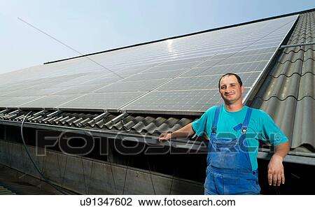 Portrait of farmer with solar panels on barn roof, Waldfeucht-Bocket, Germany View Large Photo Image Stock Image - Portrait of farmer with solar panels on barn roof, Waldfeucht-Bocket, Germany. Fotosearch