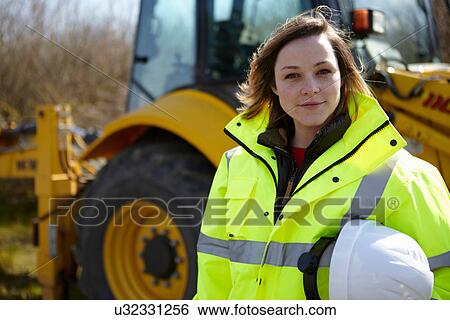 Portrait of female project manager on construction site View Large Photo Image Stock Photograph - Portrait of female project manager on construction site. Fotosearch
