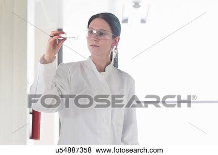 Portrait of female scientist examining test tube View Large Photo Image Stock Photo - Portrait of female scientist examining test tube. Fotosearch