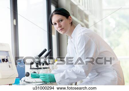 Portrait of female scientist using laboratory equipment View Large Photo Image Picture - Portrait of female scientist using laboratory equipment. Fotosearch