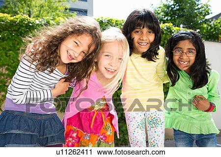 Portrait of four girls in garden View Large Photo Image Stock Image - Portrait of four girls in garden. Fotosearch