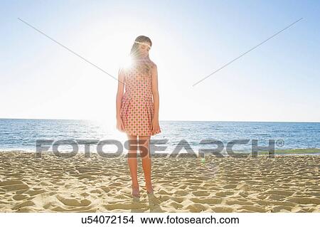 Portrait of girl on beach looking down View Large Photo Image Picture - Portrait of girl on beach looking down. Fotosearch