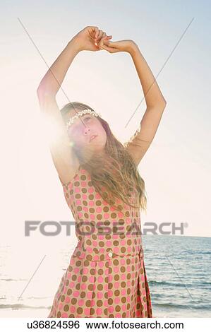 Portrait of girl on beach posing as dancer View Large Photo Image Stock Photograph - Portrait of girl on beach posing as dancer. Fotosearch