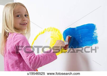Portrait of girl painting on wall View Large Photo Image Stock Photography - Portrait of girl painting on wall. Fotosearch