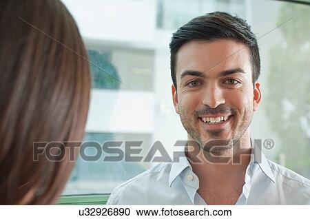 Portrait of smiling young male office worker View Large Photo Image Stock Image - Portrait of smiling young male office worker. Fotosearch