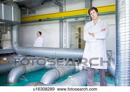 Portrait of two scientists in technical laboratory View Large Photo Image Stock Photo - Portrait of two scientists in technical laboratory. Fotosearch
