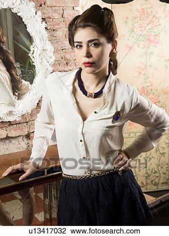 Stock Image - Portrait of woman in vintage clothes. Fotosearch