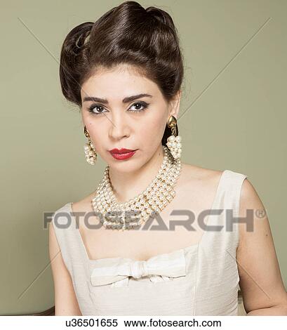Stock Photography - Portrait of woman in vintage clothes and pearls. Fotosearch
