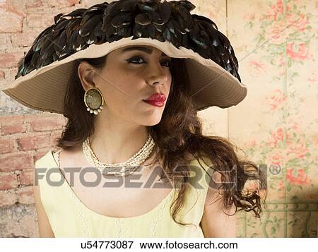 Portrait of woman in wide brimmed hat with feathers View Large Photo Image Stock Photo - Portrait of woman in wide brimmed hat with feathers. Fotosearch