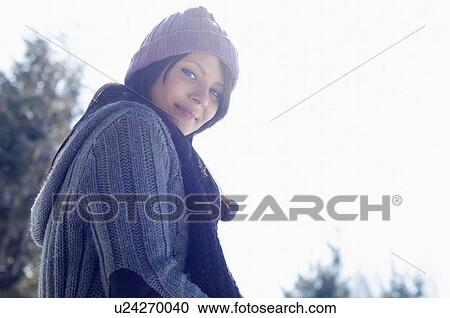 Portrait of young female wearing knitted hat View Large Photo Image Stock Image - Portrait of young female wearing knitted hat. Fotosearch