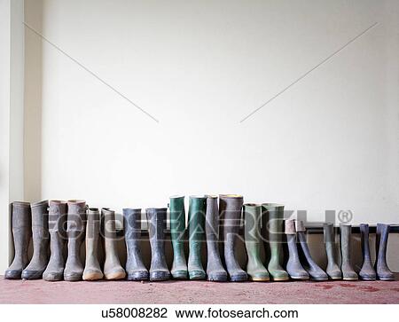 Stock Image - Rubber boots in a row. Fotosearch