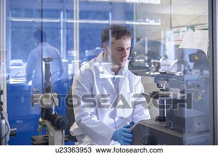Scientist working on specialist equipment in laboratory View Large Photo Image Stock Image - Scientist working on specialist equipment in laboratory. Fotosearch