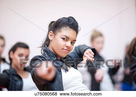 Small group of teenagers dancing in studio View Large Photo Image Stock Photo - Small group of teenagers dancing in studio. Fotosearch