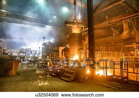 Steel workers watching furnace in steel foundry View Large Photo Image Stock Photo - Steel workers watching furnace in steel foundry. Fotosearch
