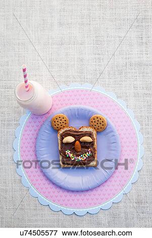 Still life of sweet food products made into smiley face View Large Photo Image Stock Photo - Still life of sweet food products made into smiley face. Fotosearch