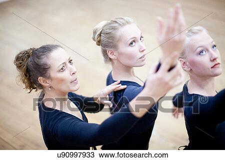 Teacher demonstrating hand pose to ballerinas View Large Photo Image Stock Image - Teacher demonstrating hand pose to ballerinas. Fotosearch
