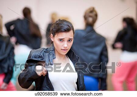 Stock Photo - Teenagers dancing hip hop in studio. Fotosearch