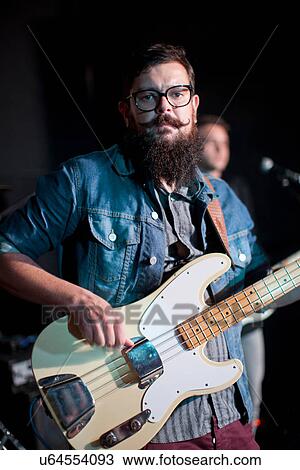 Two men playing guitars on stage in club View Large Photo Image Stock Image - Two men playing guitars on stage in club. Fotosearch