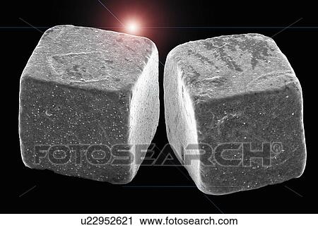 Stock Image - Two salt crystals, SEM. Fotosearch