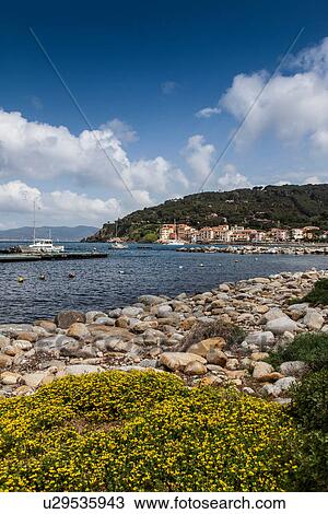 Stock Image - View of Marciana town from shoreline, Elba Island, Italy. Fotosearch
