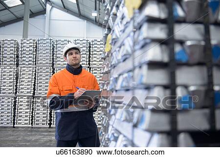 Warehouse worker checking stock View Large Photo Image Stock Image - Warehouse worker checking stock. Fotosearch