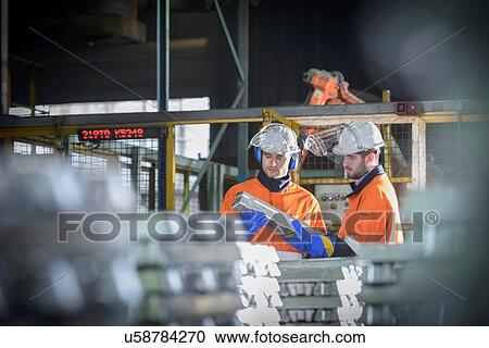 Warehouse workers checking aluminum ingots View Large Photo Image Stock Image - Warehouse workers checking aluminum ingots. Fotosearch