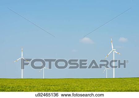 Wind turbines on horizon, Selfkant, Germany View Large Photo Image Stock Photograph - Wind turbines on horizon, Selfkant, Germany. Fotosearch