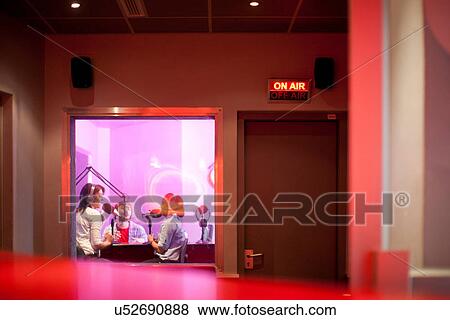 Women and man broadcasting in recording studio View Large Photo Image Stock Photo - Women and man broadcasting in recording studio. Fotosearch