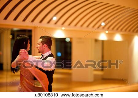 Young ballroom dancers in studio View Large Photo Image Stock Image - Young ballroom dancers in studio. Fotosearch