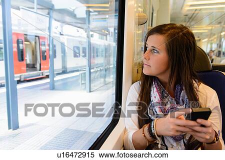 Young female tourist on local train, Catalonia, Spain View Large Photo Image Stock Photography - Young female tourist on local train, Catalonia, Spain. Fotosearch