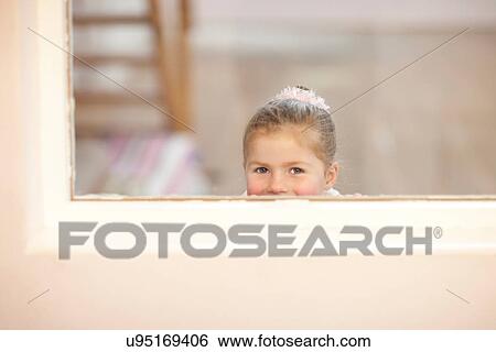 Young girl looking through window at ballet class View Large Photo Image Stock Photograph - Young girl looking through window at ballet class. Fotosearch