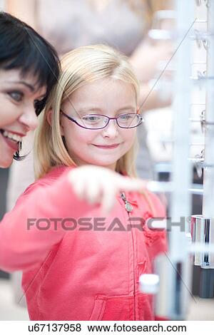 Young girl pointing to eyeglasses View Large Photo Image Stock Photo - Young girl pointing to eyeglasses. Fotosearch