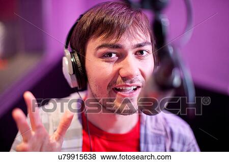 Young man broadcasting in recording studio, portrait View Large Photo Image Stock Photo - Young man broadcasting in recording studio, portrait. Fotosearch