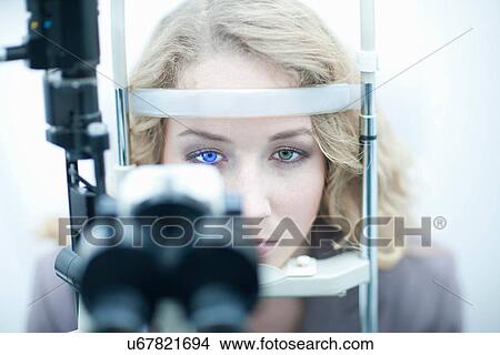 Young woman having eye examination View Large Photo Image Picture - Young woman having eye examination. Fotosearch