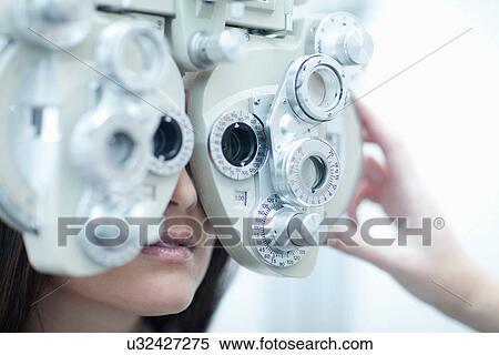 Young woman having eye test View Large Photo Image Stock Photography - Young woman having eye test. Fotosearch