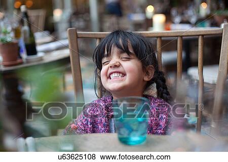 A little girl playing by herself View Large Photo Image Stock Photo - A little girl playing by herself. Fotosearch