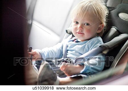 Baby boy in back seat of car View Large Photo Image Stock Photo - Baby boy in back seat of car. Fotosearch