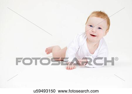 Stock Image - Baby girl crawling. Fotosearch