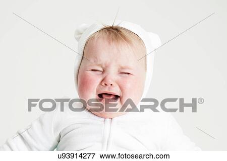 Stock Photo - Baby girl crying. Fotosearch