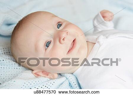 Baby smiling in fascination View Large Photo Image Stock Image - Baby smiling in fascination. Fotosearch