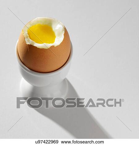 Boiled egg in egg cup View Large Photo Image Stock Photo - Boiled egg in egg cup. Fotosearch