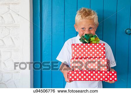 Boy excited at gifts View Large Photo Image Stock Photograph - Boy excited at gifts. Fotosearch