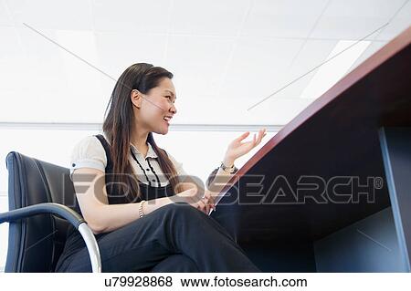 Stock Photo - Business executive at desk. Fotosearch