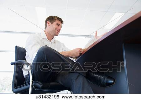 Stock Photography - Business executive at desk. Fotosearch