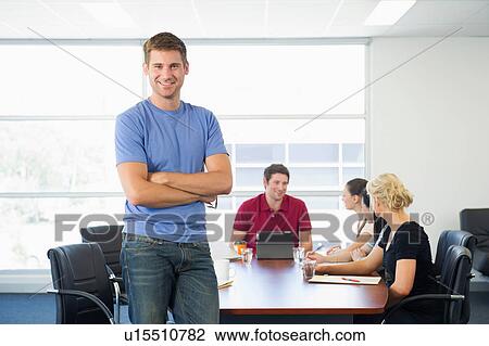 Business executive standing at front of brainstorming meeting View Large Photo Image Stock Image - Business executive standing at front of brainstorming meeting. Fotosearch