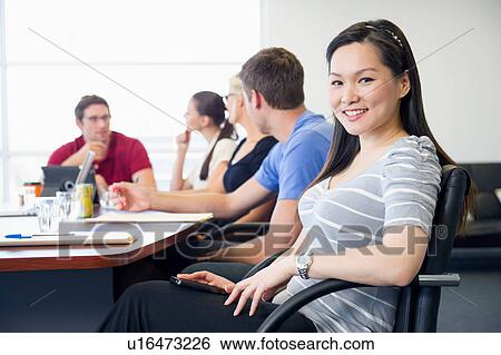 Business executive turning away from brainstorming meeting View Large Photo Image Stock Photograph - Business executive turning away from brainstorming meeting. Fotosearch