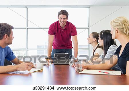 Business executives at brainstorming meeting View Large Photo Image Picture - Business executives at brainstorming meeting. Fotosearch