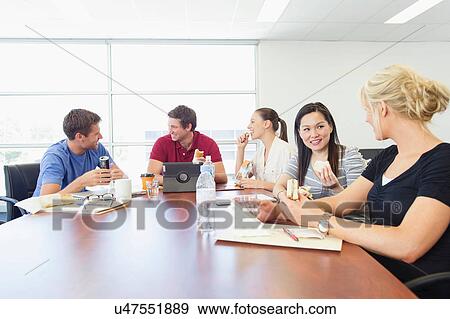 Stock Photo - Business executives at brainstorming meeting. Fotosearch